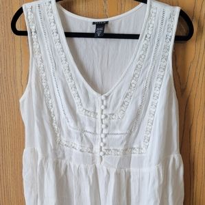 Torrid white flowy peplum top